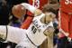 Michigan State's Denzel Valentine (45) falls as he drive against Ohio State during the first half of an NCAA college basketball game in the quarterfinals at the Big Ten Conference tournament, Friday, March 11, 2016, in Indianapolis. AP Photo/Michael Conroy)