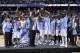 WASHINGTON, DC - MARCH 12: The North Carolina Tar Heels hold up the conference trophy after defeating the Virginia Cavaliers 61-57 to win the 2016 ACC Basketball Tournament at Verizon Center on March 12, 2016 in Washington, DC. (Photo by Rob Carr/Getty Images)