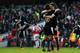 LONDON, ENGLAND - MARCH 13: Nathan Ake (16) and Craig Cathcart of Watford (15) celebrate victory after the Emirates FA Cup sixth round match between Arsenal and Watford at Emirates Stadium on March 13, 2016 in London, England. (Photo by Shaun Botterill/Getty Images)