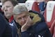 Arsenal's French manager Arsene Wenger reacts in his seat as his team try to come back from two goals down in the FA Cup quarter final football match between Arsenal and Watford at the Emirates Stadium in London on March 13, 2016. / AFP / Ian Kington / RESTRICTED TO EDITORIAL USE. No use with unauthorized audio, video, data, fixture lists, club/league logos or 'live' services. Online in-match use limited to 75 images, no video emulation. No use in betting, games or single club/league/player publications. / (Photo credit should read IAN KINGTON/AFP/Getty Images)