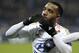 Lyon's Alexandre Lacazette celebrates after scoring a goal during the French League One soccer match between Lyon and Guingamp in Decines, near Lyon, central France, Sunday, March 6, 2016. (AP Photo/Laurent Cipriani)
