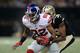 NEW ORLEANS, LA - NOVEMBER 01: Brandon Browner #39 of the New Orleans Saints tries to bring down Rueben Randle #82 of the New York Giants during the second quarter of a game at the Mercedes-Benz Superdome on November 1, 2015 in New Orleans, Louisiana. (Photo by Chris Graythen/Getty Images)