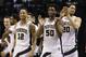 Purdue's Vince Edwards (12), Purdue's Caleb Swanigan (50) and Purdue's A.J. Hammons (20) celebrate during the second half of an NCAA college basketball game against the Illinois in the quarterfinals at the Big Ten Conference tournament, Friday, March 11, 2016, in Indianapolis. Purdue won 89-58. (AP Photo/Michael Conroy)