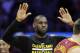 Cleveland Cavaliers forward LeBron James raises his hands for high fives by teammates during a timeout in the second half of an NBA basketball game against the Los Angeles Clippers in Los Angeles, Sunday, March 13, 2016. The Cavaliers won 114-90. (AP Photo/Alex Gallardo)