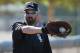 Chicago White Sox's Adam LaRoche catches the baseball as he warms up during a spring training baseball workout Wednesday, Feb. 24, 2016, in Glendale, Ariz. (AP Photo/Ross D. Franklin)