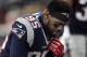 New England Patriots defensive end Chandler Jones kneels before an NFL divisional playoff football game against the Kansas City Chiefs, Saturday, Jan. 16, 2016, in Foxborough, Mass. (AP Photo/Charles Krupa)