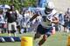 San Diego Chargers running back Donald Brown runs through an obstacle course at opening day of training camp at Chargers' Park Thursday, July 30, 2015, in San Diego. (AP Photo/Lenny Ignelzi)
