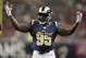 St. Louis Rams defensive end William Hayes holds up his arms during the second quarter of an NFL football game against the Cleveland Browns Sunday, Oct. 25, 2015, in St. Louis. (AP Photo/Tom Gannam)