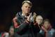Manchester United's Dutch manager Louis van Gaal applauds supporters after the UEFA Europa League round of 16, second leg football match between Manchester United and Liverpool at Old Trafford in Manchester, north west England on March 17, 2016.
The game ended 1-1, Liverpool going through 3-1 on aggregate. / AFP / OLI SCARFF (Photo credit should read OLI SCARFF/AFP/Getty Images)