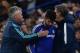 Chelsea's Brazilian-born Spanish striker Diego Costa gets pats from Chelsea's Dutch interim manager Guus Hiddink (L) and Paris Saint-Germain's French head coach Laurent Blanc (R) as he leaves the pitch injured during the UEFA Champions League round of 16 second leg football match between Chelsea and Paris Saint-Germain (PSG) at Stamford Bridge in London on March 9, 2016. / AFP / BEN STANSALL (Photo credit should read BEN STANSALL/AFP/Getty Images)