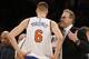 New York Knicks interim coach Kurt Rambis talks to forward Kristaps Porzingis during a timeout in the second half of the team's NBA basketball game against the Portland Trail Blazers at Madison Square Garden in New York, Tuesday, March 1, 2016. The Blazers won 104-85. (AP Photo/Kathy Willens)