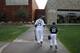 FILE - In this Feb. 28, 2015, file photo, Chicago White Sox's Adam LaRoche, left, and his son Drake walk to the White Sox's clubhouse during a photo day before a baseball spring training workout in Phoenix. Kudos to Adam LaRoche for wanting to spend time with his son, and walking away from a $13 million salary to make sure that happened. But there's nothing wrong with the White Sox telling the now-retired first baseman that