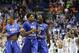 Middle Tennessee Darnell Harris (0), Perrin Buford (2) and Jaqawn Raymond, left, celebrate as they walk off the court after winning a first-round men's college basketball game against Michigan State in the NCAA Tournament, Friday, March 18, 2016, in St. Louis. Middle Tennessee won 90-81. (AP Photo/Charlie Riedel)