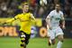 Dortmund's forward Marco Reus (L) and Augsburg's midfielder Markus Feulner vie for the ball during the German first division football Bundesliga match between Borussia Dortmund and FC Augsburg on October 25, 2015 in Dortmund, western Germany. Dortmund wom the match 5-1. AFP PHOTO / ODD ANDERSEN (Photo credit should read ODD ANDERSEN/AFP/Getty Images)