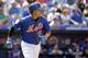 New York Mets' Ruben Tejada watches his two-run home run during the fifth inning of an exhibition spring training baseball game against the St. Louis Cardinals Thursday, March 10, 2016, in Port St. Lucie, Fla. (AP Photo/Jeff Roberson)