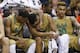 Notre Dame guard Demetrius Jackson, left, consoles forward Bonzie Colson, center as they sit on the bench with forward Zach Auguste (30) during the second half of an NCAA college basketball game against North Carolina in the Atlantic Coast Conference men's tournament, Friday, March 11, 2016, in Washington. North Carolina defeated Notre Dame 78-47. (AP Photo/Steve Helber)