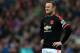 Manchester United's captain Wayne Rooney stands dejected as Sunderland's Wahbi Khazri celebrates his goal during the English Premier League soccer match between Sunderland and Manchester United at the Stadium of Light, Sunderland, England, Saturday, Feb. 13, 2016. (AP Photo/Scott Heppell)