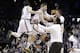 Notre Dame's Rex Pflueger, center, and Matt Farrell, left, celebrate with teammates after a second-round men's college basketball game in the NCAA Tournament, Sunday, March 20, 2016, in New York. Notre Dame won 76-75. (AP Photo/Frank Franklin II)