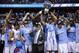 WASHINGTON, DC - MARCH 12: The North Carolina Tar Heels hold up the conference trophy after defeating the Virginia Cavaliers 61-57 to win the 2016 ACC Basketball Tournament at Verizon Center on March 12, 2016 in Washington, DC. (Photo by Rob Carr/Getty Images)
