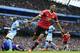 Rashford celebrates his winner at the Etihad.