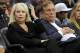 FILE - In this Nov. 12, 2010, file photo, Shelly Sterling sits with her husband, Donald Sterling, right, during the Los Angeles Clippers' NBA basketball game against the Detroit Pistons in Los Angeles. Former Los Angeles Clippers owner Donald Sterling and his wife Shelly Sterling have decided to stay in their six-decade marriage. (AP Photo/Mark J. Terrill, File)