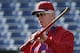 Philadelphia Phillies guest instructor Mike Schmidt, a Hall of Famer, uses a ball and a bat to demonstrate a principle of hitting during batting before a spring training baseball game against the Detroit Tigers in Clearwater, Fla., Sunday, March 29, 2015. (AP Photo/Kathy Willens)