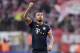 Bayern's Arturo Vidal reacts to supporters after the German Bundesliga soccer match between 1. FC Cologne and Bayern Munich in Cologne, Germany, Saturday, March 19, 2016. Cologne was defeated by Bayern with 0-1. (AP Photo/Martin Meissner)