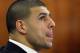 Former New England Patriots NFL football player Aaron Hernandez is seated during his murder trial, Thursday, April 2, 2015, in Fall River, Mass. Hernandez is charged with killing Odin Lloyd in June 2013. (AP Photo/Steven Senne, Pool)