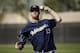 FILE - In this Tuesday, March 1, 2016 file photo, Milwaukee Brewers' Will Smith throws during a spring training baseball workout in Phoenix. The Milwaukee Brewers will start the season without reliever Will Smith, who tore a ligament in his right knee while taking his spikes off after a game, Saturday, March 26, 2016. (AP Photo/Morry Gash, File)