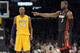 Miami Heat guard Dwyane Wade (3) points as Los Angeles Lakers guard Kobe Bryant (24) stands by during the first half of their NBA basketball game, Thursday, Jan. 17, 2013, in Los Angeles. (AP Photo/Mark J. Terrill)
