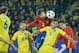 Spains defender Gerard Pique (C) and Romanias defender Ovidiu Stefan Hoban vie for the ball during the friendly football match between Romania and Spain in Cluj Napoca, Romania on March 27, 2016. / AFP / ANDREI PUNGOVSCHI (Photo credit should read ANDREI PUNGOVSCHI/AFP/Getty Images)
