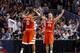 Syracuse's Michael Gbinije (0) and Trevor Cooney (10) celebrate after a college basketball game against Virginia in the regional finals of the NCAA Tournament, Sunday, March 27, 2016, in Chicago. Syracuse won 68-62. (AP Photo/Charles Rex Arbogast)