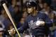 Atlanta Braves' Nick Swisher tosses his bat after striking out swinging during the ninth inning of a baseball game against the Chicago Cubs, Thursday, Aug. 20, 2015, in Chicago. The Cubs won 7-1. (AP Photo/Nam Y. Huh)