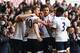 LONDON, ENGLAND - MARCH 20: Harry Kane of Tottenham Hotspur (10) celebrates with team mates as he scores their first goal during the Barclays Premier League match between Tottenham Hotspur and A.F.C. Bournemouth at White Hart Lane on March 20, 2016 in London, United Kingdom. (Photo by Paul Gilham/Getty Images)