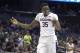 Connecticut center Amida Brimah (35) celebrates on the court at the end of the second half of an NCAA college basketball game against Memphis in the finals of the American Athletic Conference men's tournament in Orlando, Fla., Sunday, March 13, 2016. Connecticut won 72-58. (AP Photo/Phelan M. Ebenhack)