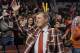 Craig Sager, acknowledges the crowd during a timeout of a game between the Chicago Bulls and the Oklahoma City Thunder, Thursday, March 5, 2015 in Chicago. Craig Sager returned to his familiar spot on the NBA sideline Thursday after being treated for leukemia. (AP Photo/David Banks)