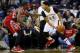 New Orleans Pelicans forward Anthony Davis (23) drives against Houston Rockets forward Terrence Jones (6) during the first half of an NBA basketball game Saturday, Dec. 26, 2015, in New Orleans. (AP Photo/Jonathan Bachman)