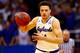 LAWRENCE, KS - DECEMBER 09: Brannen Greene #14 of the Kansas Jayhawks drives toward the basket during the game against the Holy Cross Crusaders at Allen Fieldhouse on December 9, 2015 in Lawrence, Kansas. (Photo by Jamie Squire/Getty Images)