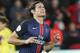 PSG's Edison Cavani, left, celebrates his opening goal with his teammates during a French League One soccer Match, Paris Saint Germain against Lorient at Parc des Princes stadium in Paris, Wednesday, Feb. 3, 2016. (AP Photo/Michel Euler)