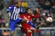 Berlin's John Anthony Brooks, left, and Bayern's Javi Martinez challenge for the ball during the German Bundesliga soccer match between FC Bayern Munich and Hertha BSC Berlin at the Allianz Arena stadium in Munich, Germany, Saturday, Nov. 28, 2015. (AP Photo/Matthias Schrader)