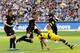 Frankfurt's Bastian Oczipka, center, and Dortmund's Pierre-Emerick Aubameyang challenge for the ball during the German first division Bundesliga soccer match between Eintracht Frankfurt and Borussia Dortmund in Frankfurt, Germany, Saturday, May 7, 2016.(AP Photo/Michael Probst)