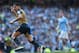 Arsenal's Chilean striker Alexis Sanchez celebrates after scoring during the English Premier League football match between Manchester City and Arsenal at the Etihad Stadium in Manchester, north west England, on May 8, 2016. / AFP / PAUL ELLIS / RESTRICTED TO EDITORIAL USE. No use with unauthorized audio, video, data, fixture lists, club/league logos or 'live' services. Online in-match use limited to 75 images, no video emulation. No use in betting, games or single club/league/player publications. / (Photo credit should read PAUL ELLIS/AFP/Getty Images)