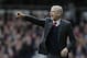 Arsenal manager Arsene Wenger gestures to his players during the English Premier League soccer match between West Ham United and Arsenal at Upton Park stadium in London, Saturday April 9, 2016. (AP Photo/Tim Ireland)
