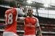 Arsenal's Theo Walcott, right, celebrates scoring his side's fourth goal with Joel Campbell during the English Premier League soccer match between Arsenal and Watford at the Emirates Stadium in London, Saturday, April 2, 2016. (AP Photo/Matt Dunham)