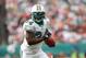 Miami Dolphins running back Ricky Williams (34) runs in the second quarter during an NFL football game against the Detroit Lions in Miami, Sunday, Dec. 26, 2010. (AP Photo/Han Deryk)