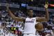 Miami Heat center Hassan Whiteside (21) reacts after dunking the ball during the second half of Game 1 of a first-round NBA basketball playoff series against the Charlotte Hornets, Sunday, April 17, 2016, in Miami. The Heat defeated the Hornets 123-91. (AP Photo/Lynne Sladky)