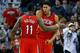 New Orleans Pelicans forward Anthony Davis, right, celebrates with guard Jrue Holiday (11) during the second half of an NBA basketball game against the Utah Jazz in New Orleans, Tuesday, Dec. 16, 2014. The Pelicans won 119-111. (AP Photo/Jonathan Bachman)