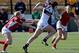 Jillion Potter of the U.S. escapes a pair of Canadian defenders in a Sevens World Series game in 2014.