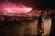A boy from Mangueira favela watch fireworks over Maracana Stadium during the 2016 Olympics closing ceremony in Rio de Janeiro on August 21, 2016. / AFP / CARL DE SOUZA (Photo credit should read CARL DE SOUZA/AFP/Getty Images)