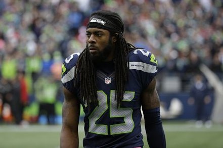 Seattle Seahawks cornerback Richard Sherman walks off the field quietly after he broke up a pass intended for Atlanta Falcons wide receiver Julio Jones late in the second half of an NFL football game, Sunday, Oct. 16, 2016, in Seattle. The Seahawks beat the Falcons 26-24. (AP Photo/Elaine Thompson)